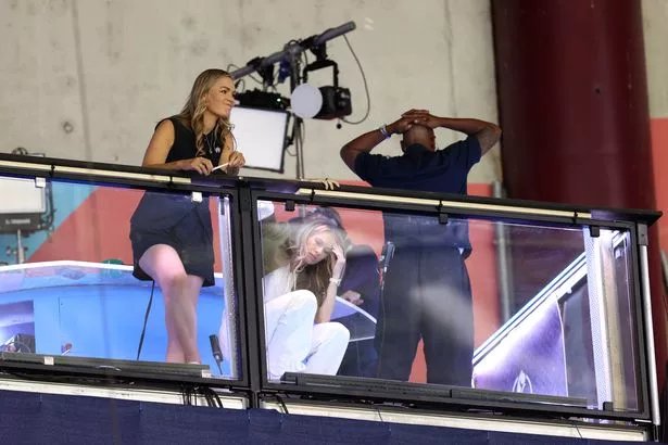 GENEVA, SWITZERLAND - JULY 22: ITV Sport Presenter Laura Wood, Former England players and current ITV Sport pundits Karen Carney and Ian Wright react during the UEFA Women's EURO 2025 Semi-Final match between England and Italy at Stade de Geneve on July 22, 2025 in Geneva, Switzerland. (Photo by Charlotte Wilson/Getty Images)