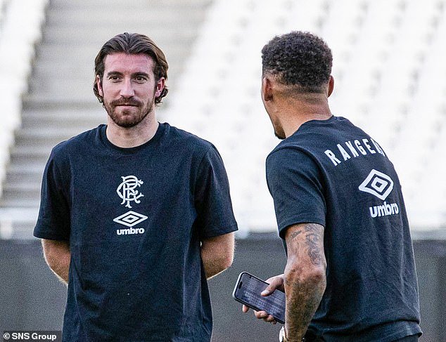 Joe Rothwell and James Tavernier enjoy a pre-match chat before the action begins