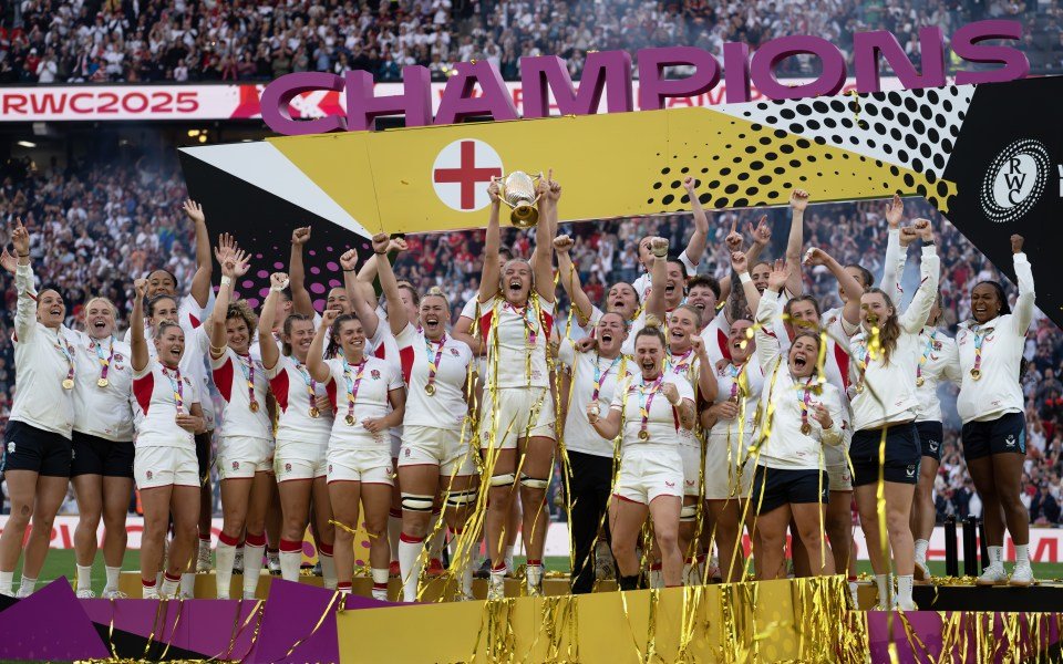 The England Red Roses celebrate their win, with Zoe Aldcroft lifting the trophy, after the Women's Rugby World Cup Final.