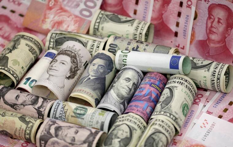 REUTERS/JASON LEE/FILE PHOTO/FILE PHOTO/FILE PHOTO
Euro, Hong Kong dollar, U.S. dollar, Japanese yen, pound and Chinese 100 yuan banknotes are seen in this picture illustration, in Beijing, China, in January 2016. The yen eased to a one-week low today after hardline conservative Sanae Takaichi was elected as Japans prime minister, with traders betting her government could muddy the interest rate outlook and bring about a greater fiscal largesse.