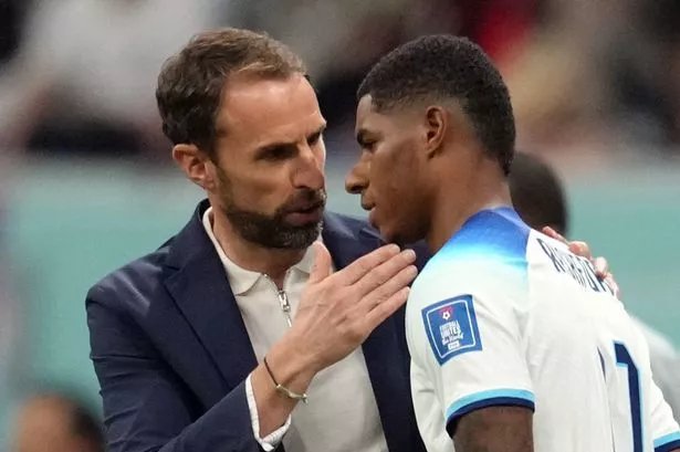 Former England manager, Gareth Southgate, pictured on the pitch with Marcus Rashford